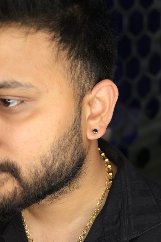 Black stud lobe piercing