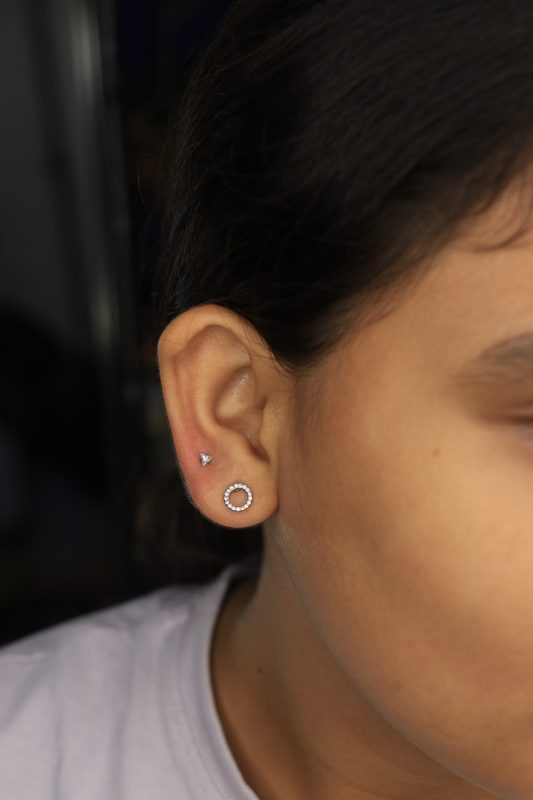 Triangle and circle stud lobe piercings