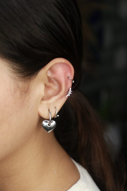 Helix piercing with heart cluster charm