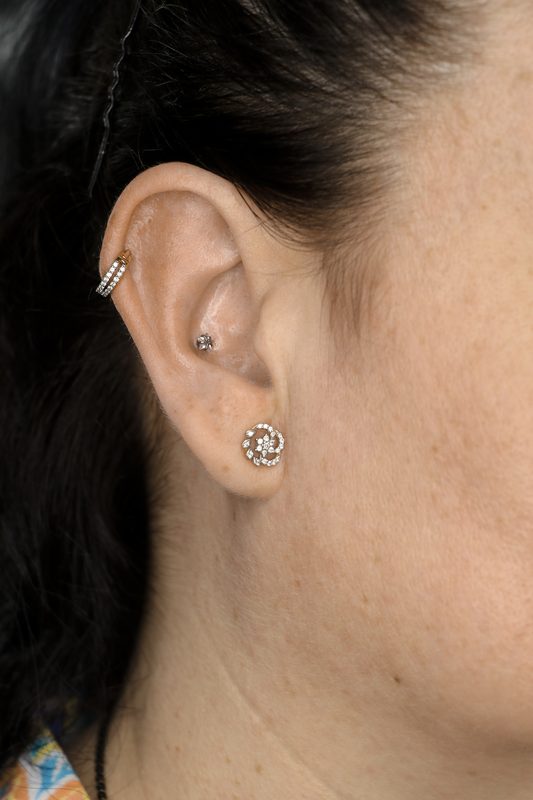Helix hoop piercing with star stud