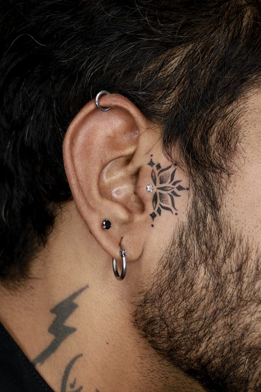 Tragus piercing with round crystal stud