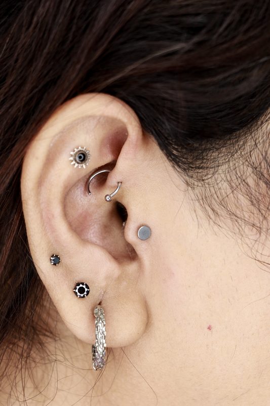 Tragus piercing with flat disc stud