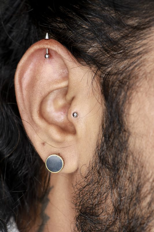 Tragus piercing with silver ball stud