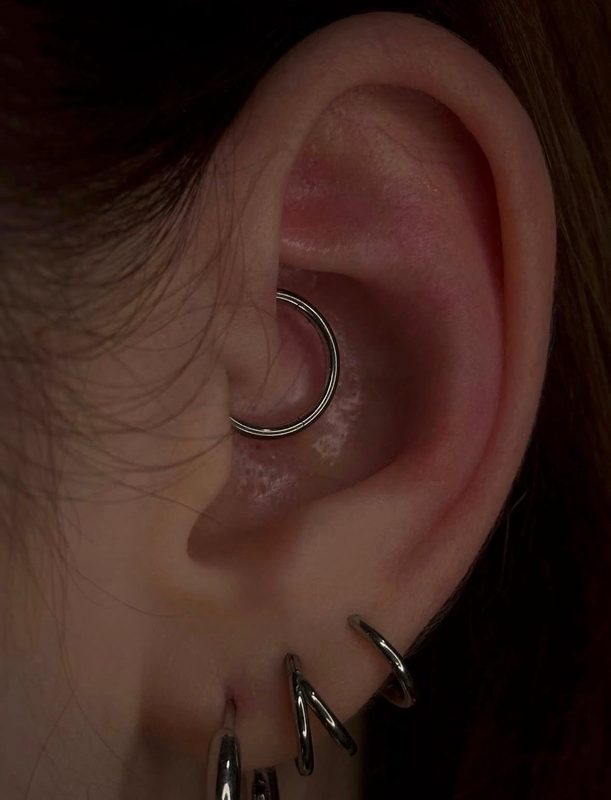 Daith piercing with silver seamless hoop