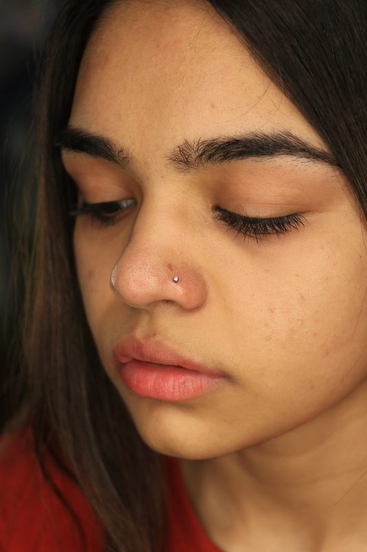 Nostril piercing with tiny crystal stud