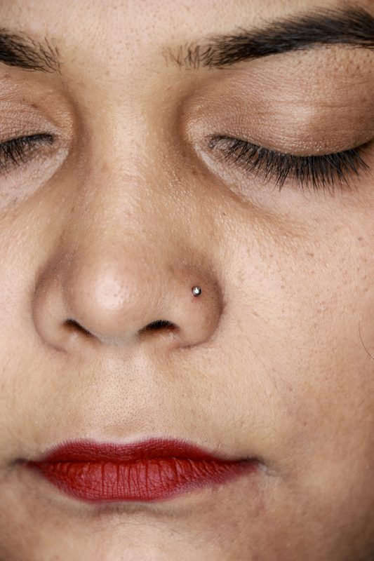 Nostril piercing with silver ball stud