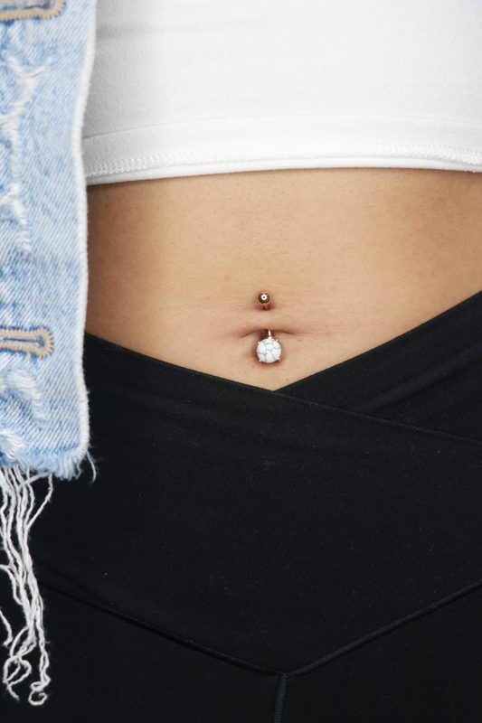 Navel piercing with rose gold white stone drop