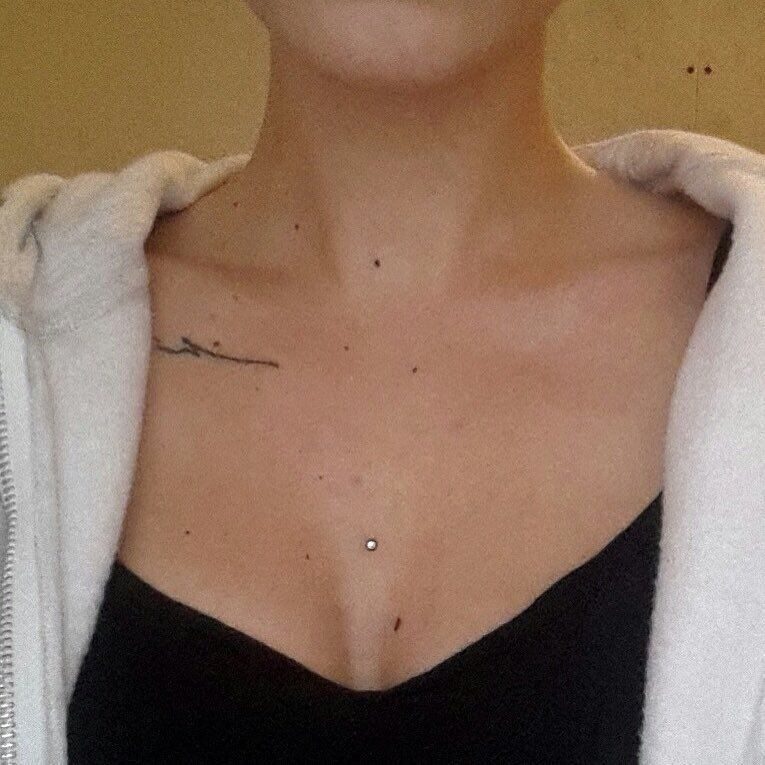 Cleavage dermal piercing with crystal stud