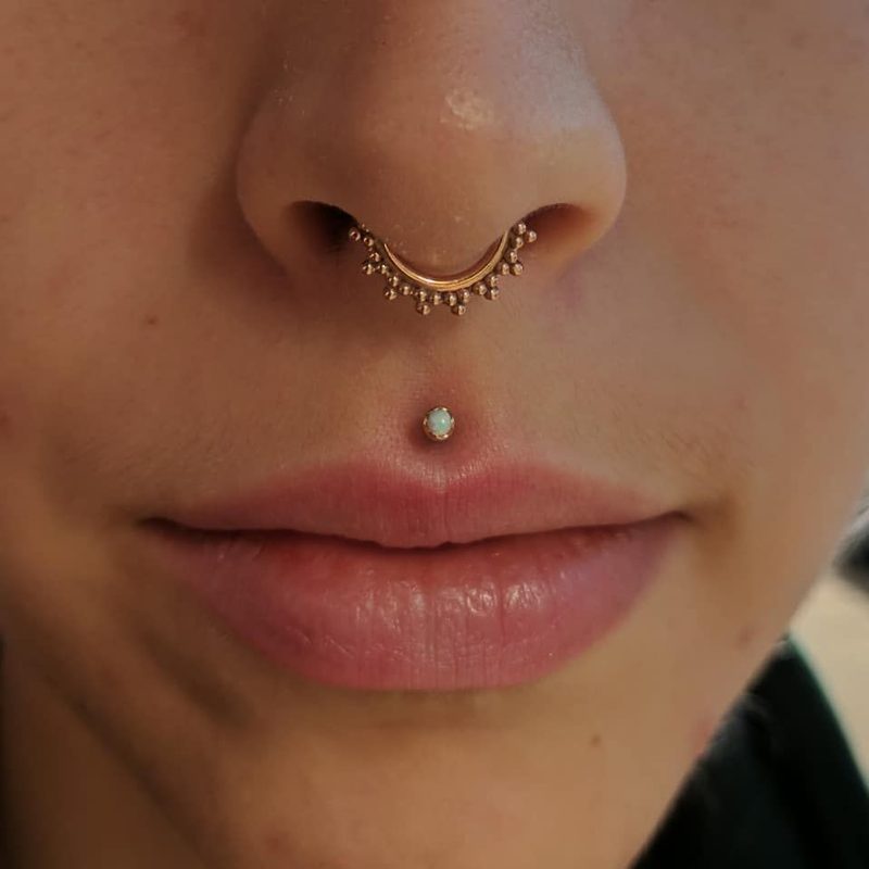 Medusa philtrum piercing with opal stud and septum ring