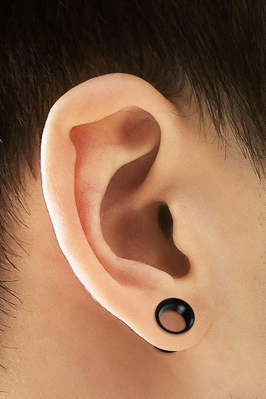 Tunnel ear lobe piercing with black flesh tunnel