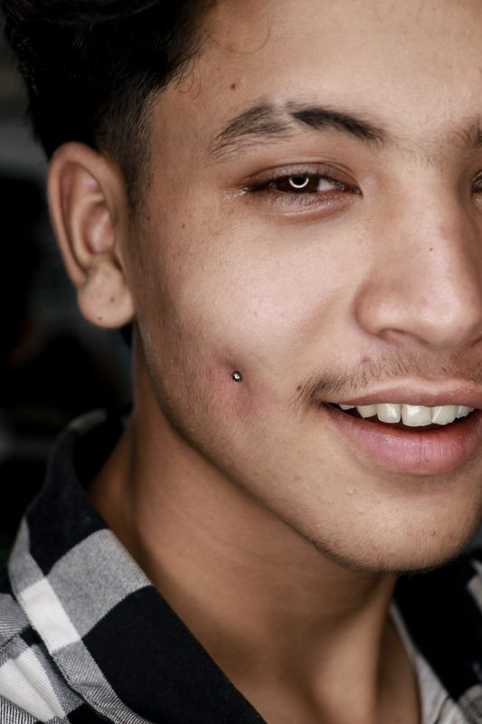 Dimple cheek piercing with silver ball stud