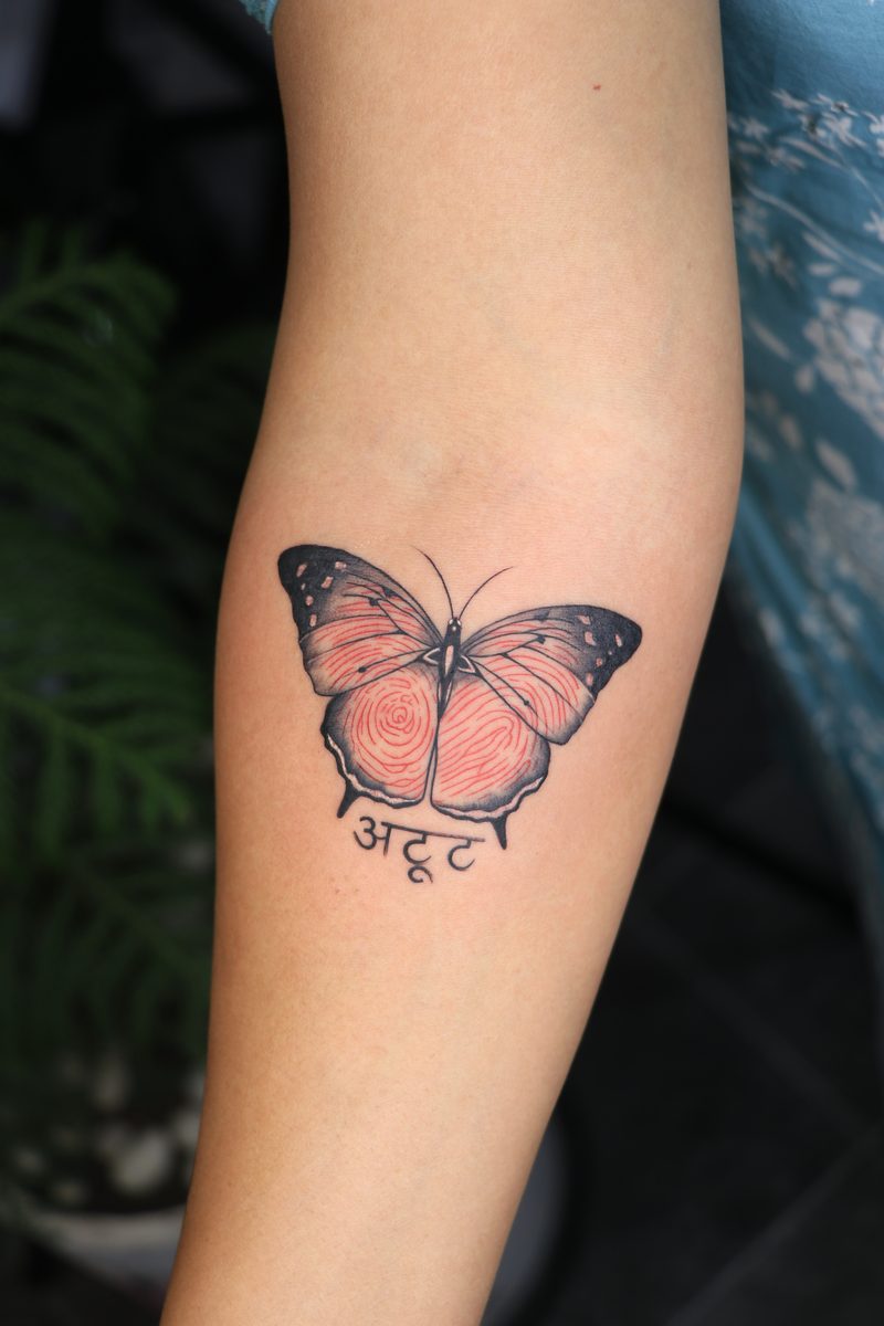 Butterfly with red fingerprint wings tattoo
