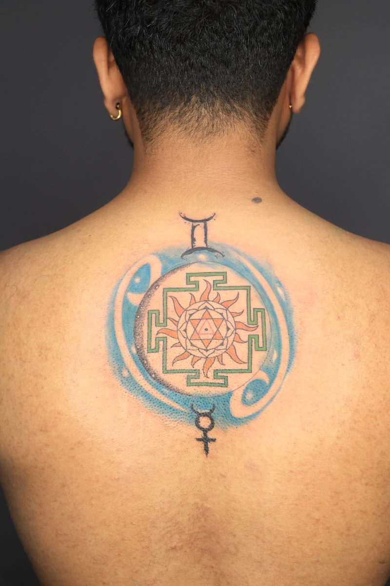 Yantra with zodiac symbols back color tattoo