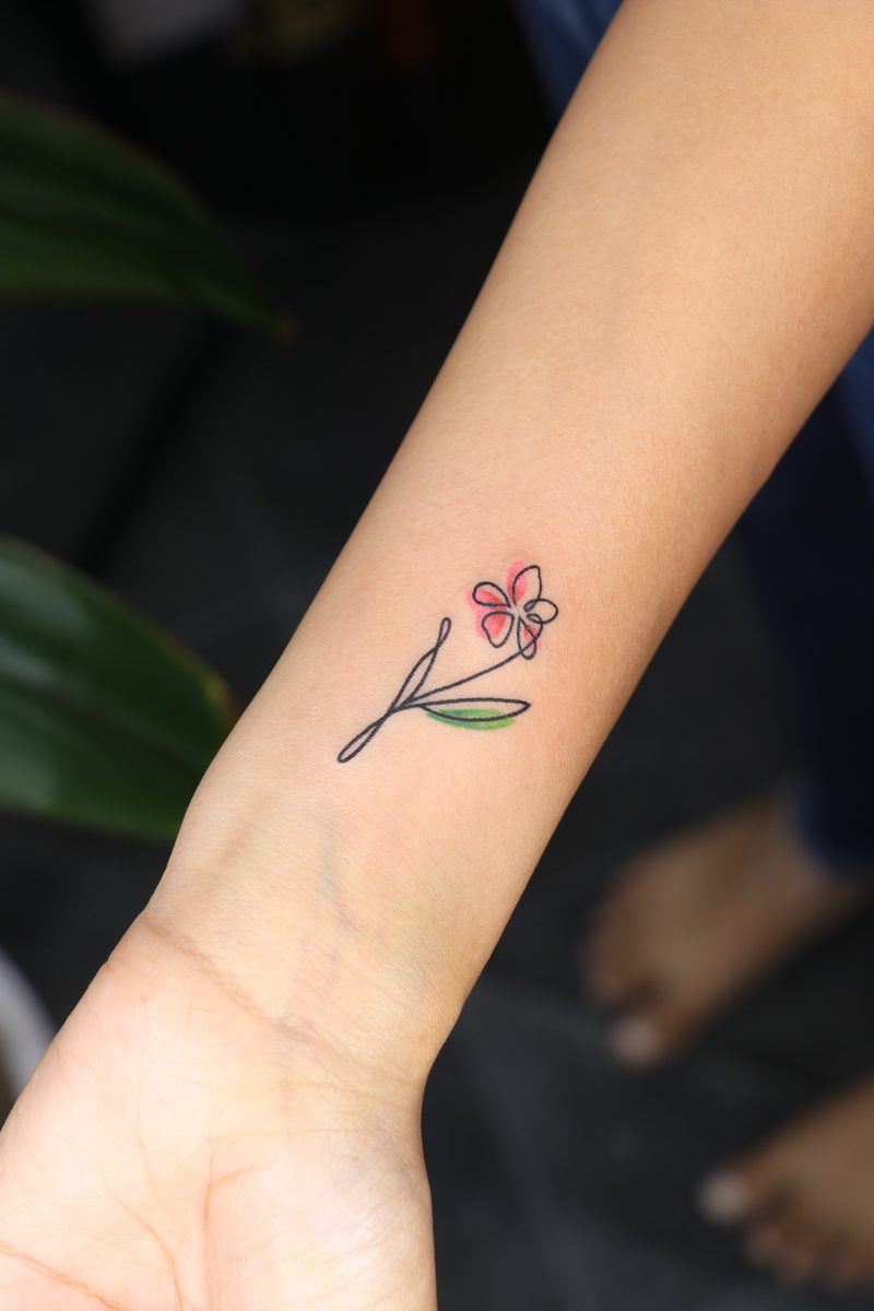 Mini flower single line color tattoo