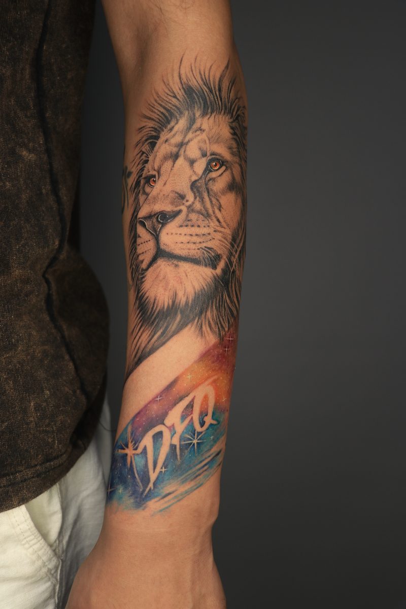 Lion with galaxy watercolor tattoo