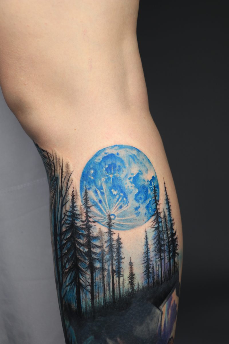 Blue moon over pine forest color tattoo