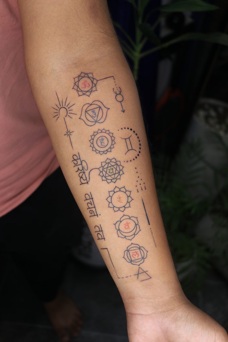 Seven chakras fine line forearm tattoo