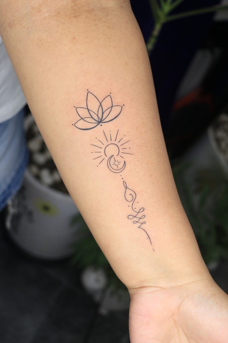 Lotus unalome fine line tattoo