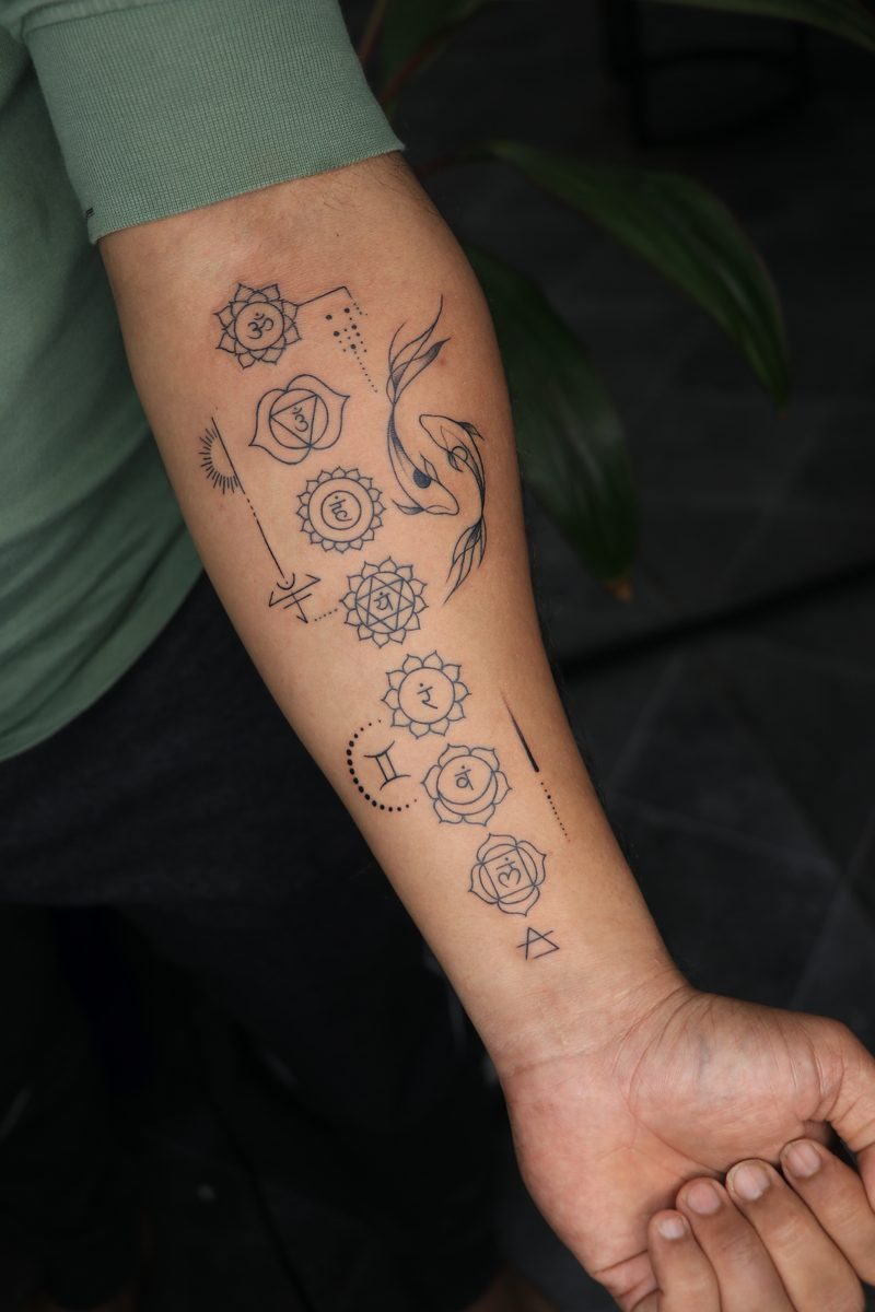 Seven chakras with koi fish fine line tattoo