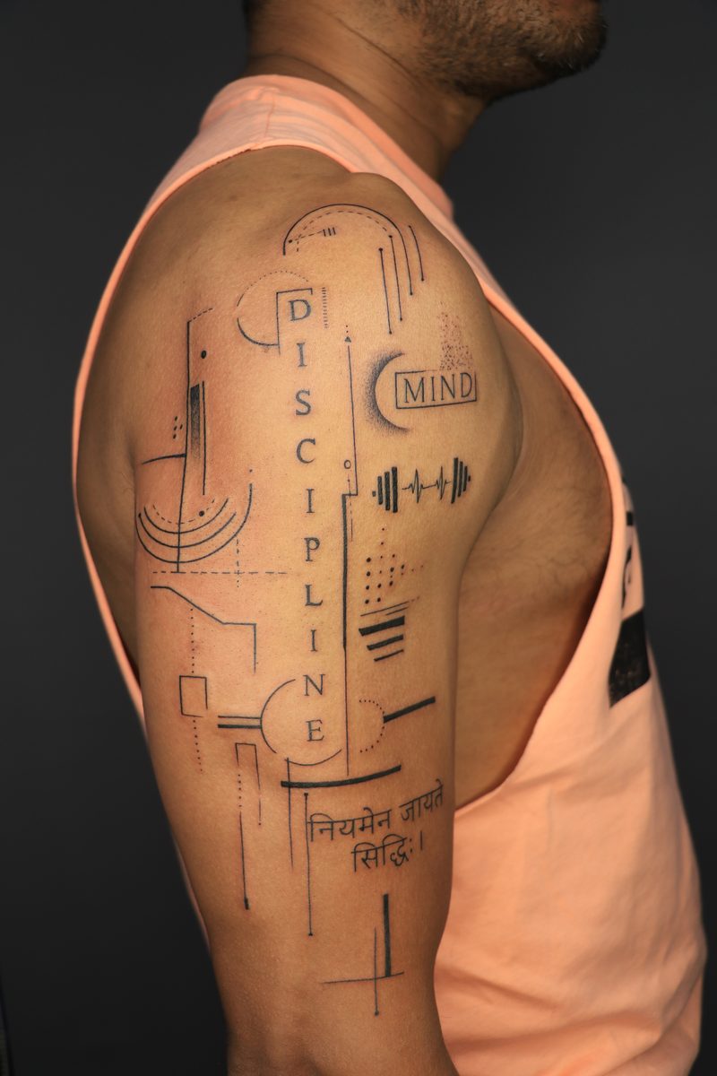 Discipline geometric fine line shoulder tattoo