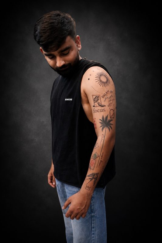 Blackwork and fineline half sleeve tattoo with sun palm and focus