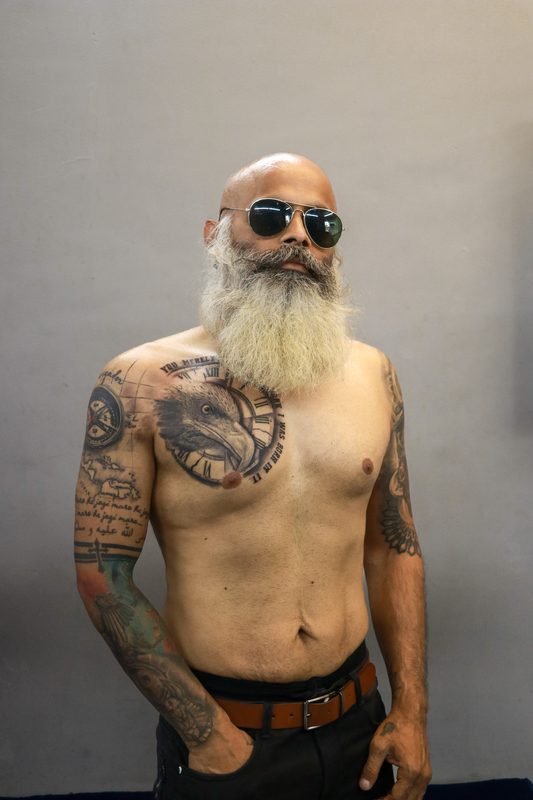 Compass map clock and portrait chest to sleeve tattoo